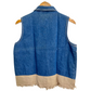 Embroidered denim vest for women back view showing plain blue back and tan frayed hem on wooden hanger
