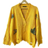 yellow knit sweater for women oversized distressed button front cardigan with embroidered birds from Stylera