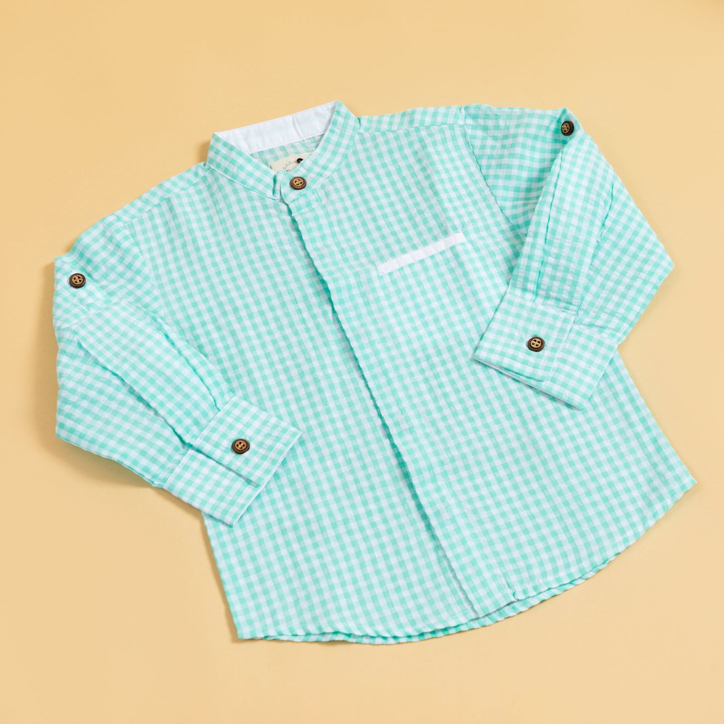 Long sleeve mint green shirt for boys featuring a stylish checkered pattern and button details
