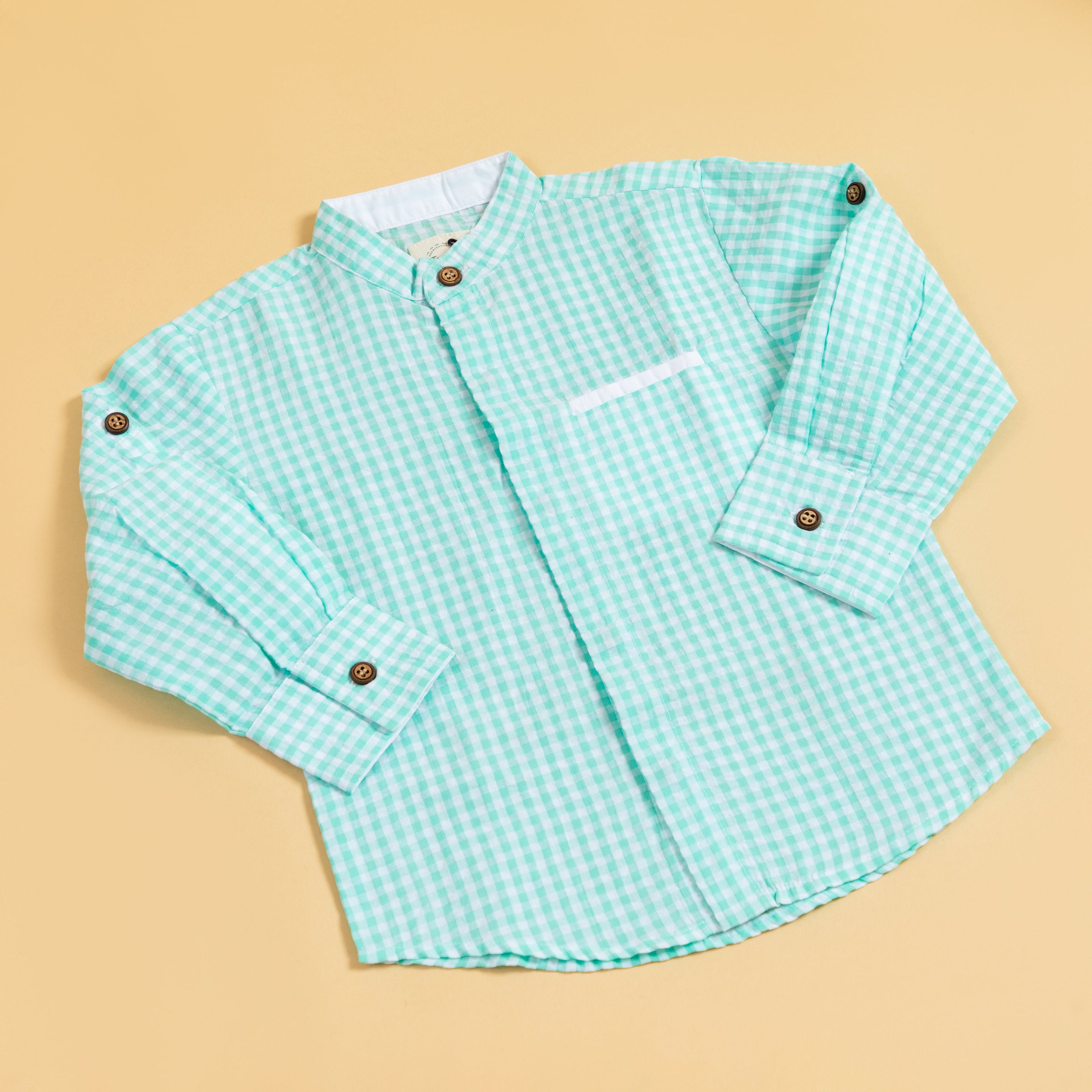 Long sleeve mint green shirt for boys featuring a stylish checkered pattern and button details