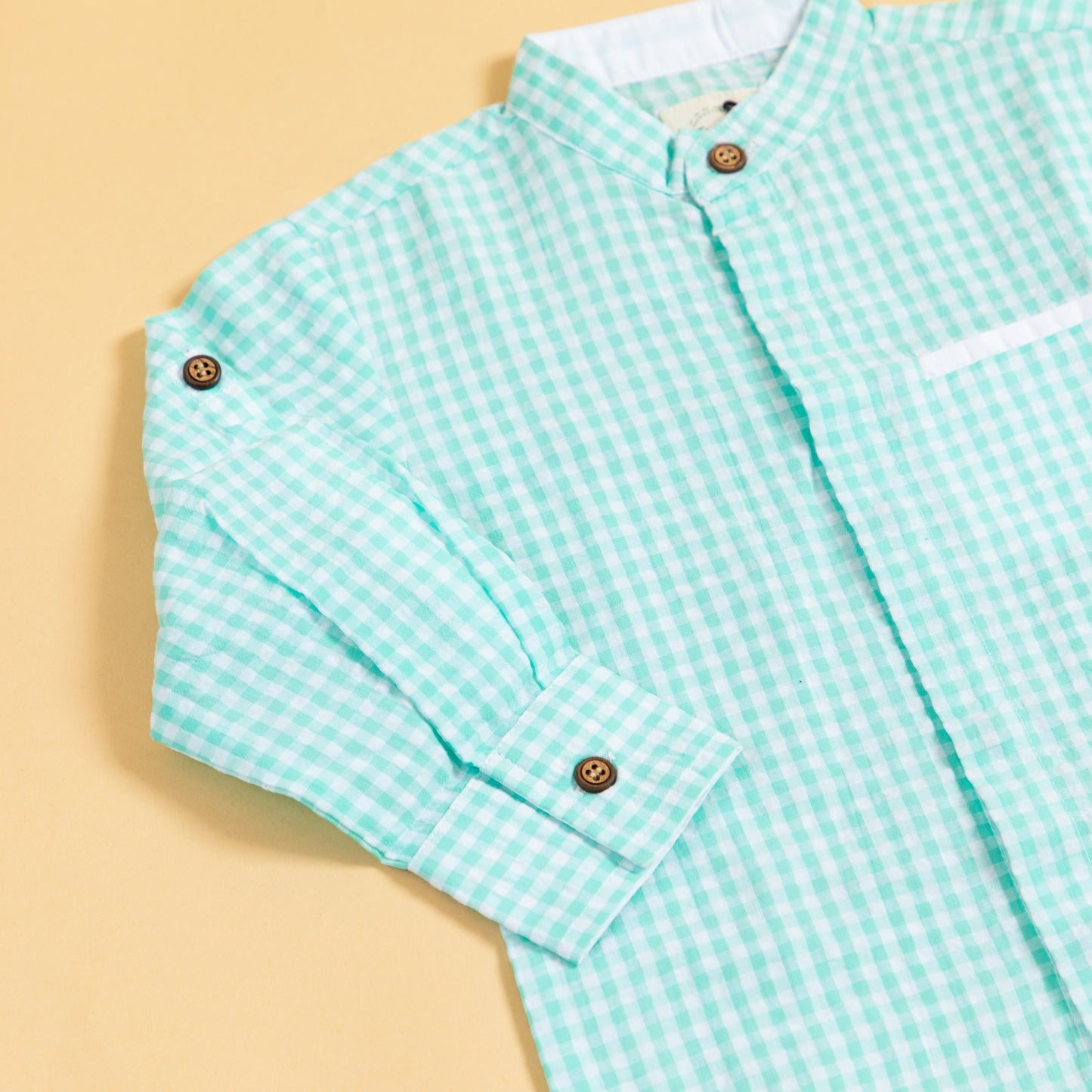 Long sleeve mint green shirt for boys with a checkered pattern and buttoned cuffs