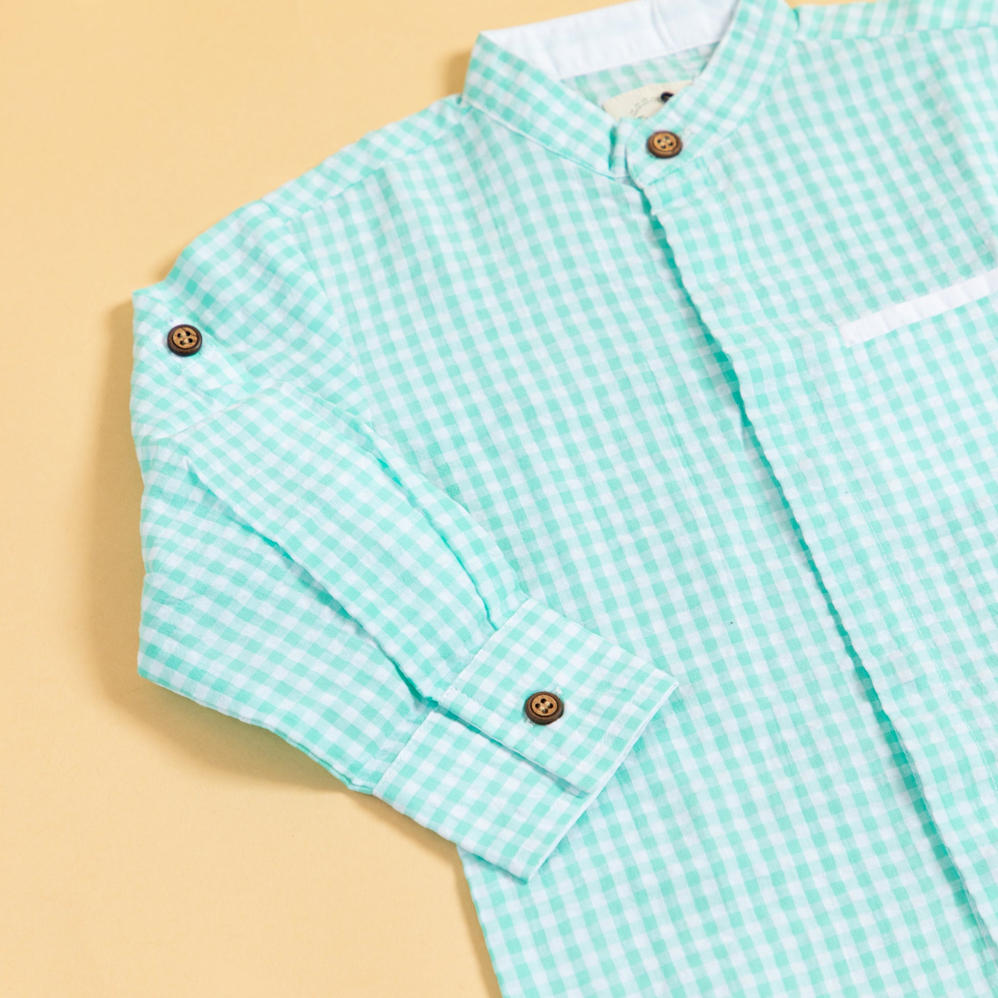 Long sleeve mint green shirt for boys with a checkered pattern and buttoned cuffs
