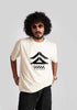 Stylera cyberpunk oversized t-shirt in white with black futuristic graphic worn by man with curly hair and sunglasses