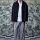 Men's oversized shacket for men in black by Stylera styled with gray pants and white shirt