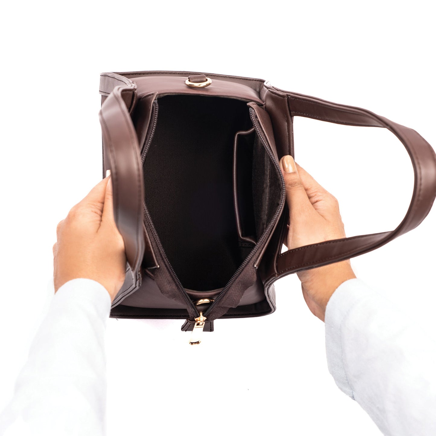 Interior view of a brown mini purse for women showcasing spacious compartments and sturdy handles