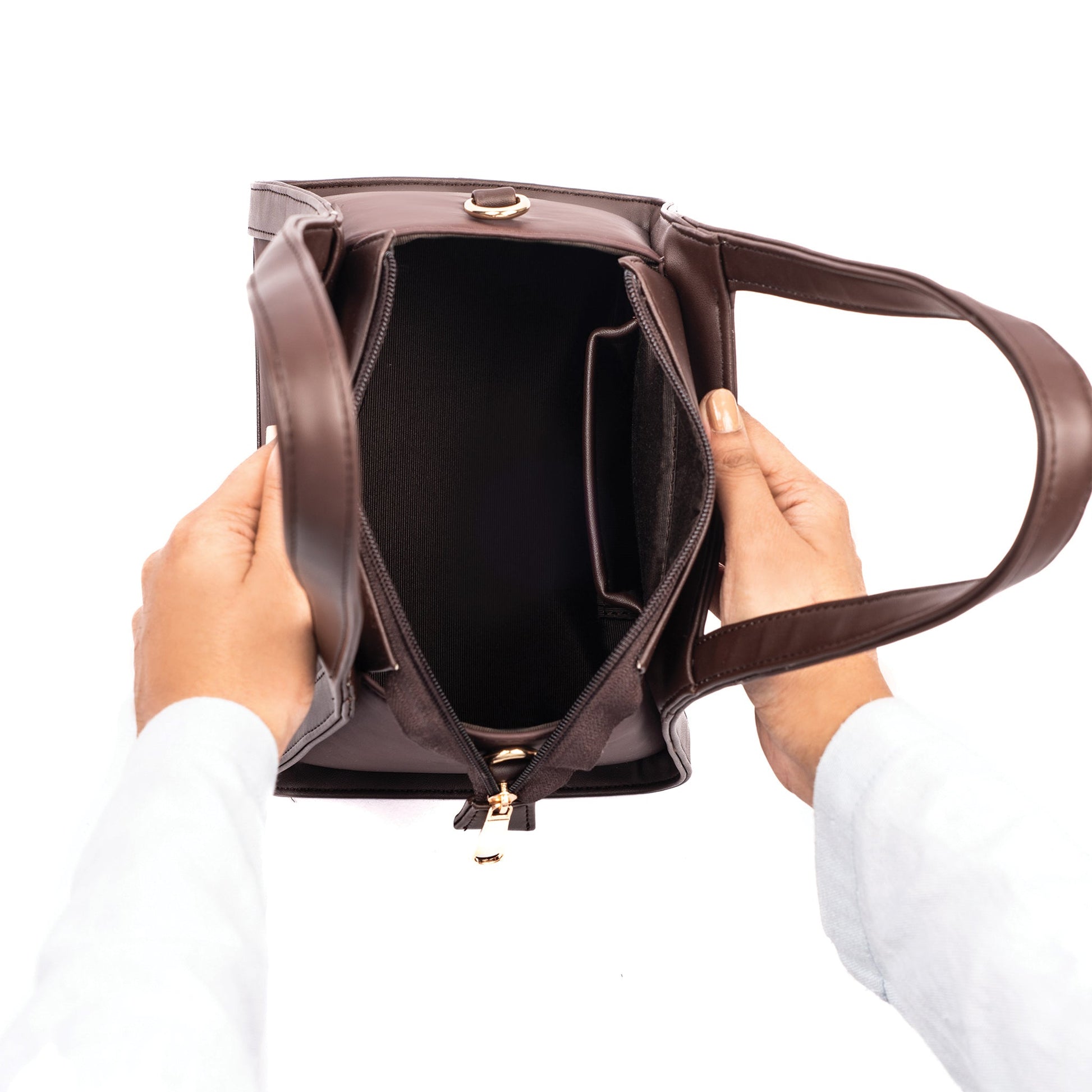 Interior view of a brown mini purse for women showcasing spacious compartments and sturdy handles