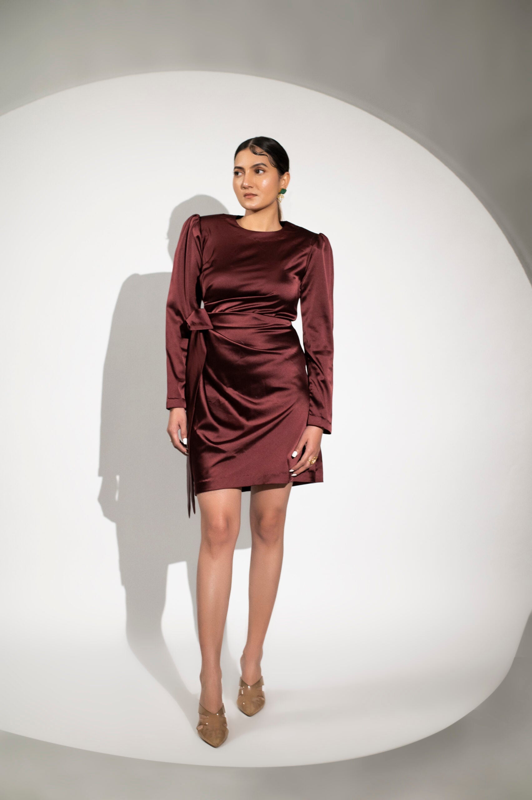 Burgundy satin party dress with puff sleeves and a wrap design for elegant evening wear