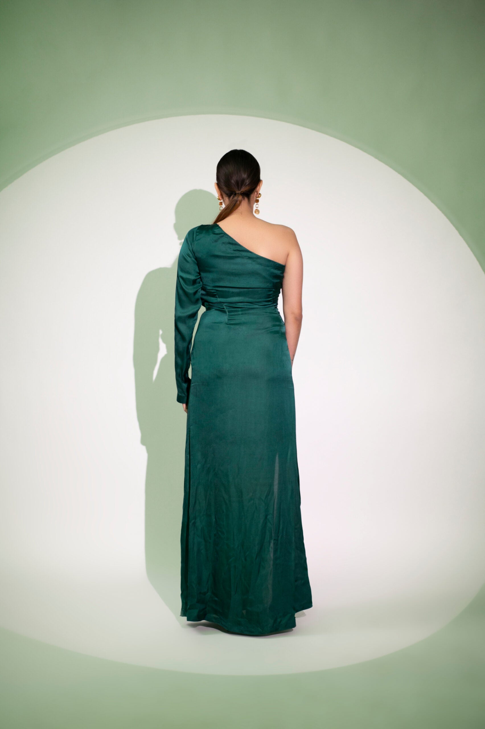 Elegant green designer single sleeve gown for women, perfect for formal occasions and evening events
