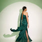 Elegant green Stylera designer single sleeve gown with a flowing skirt perfect for formal events. Buy designer single sleeve gown.