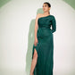 Elegant designer single sleeve gown in green with thigh-high slit for a stylish evening look