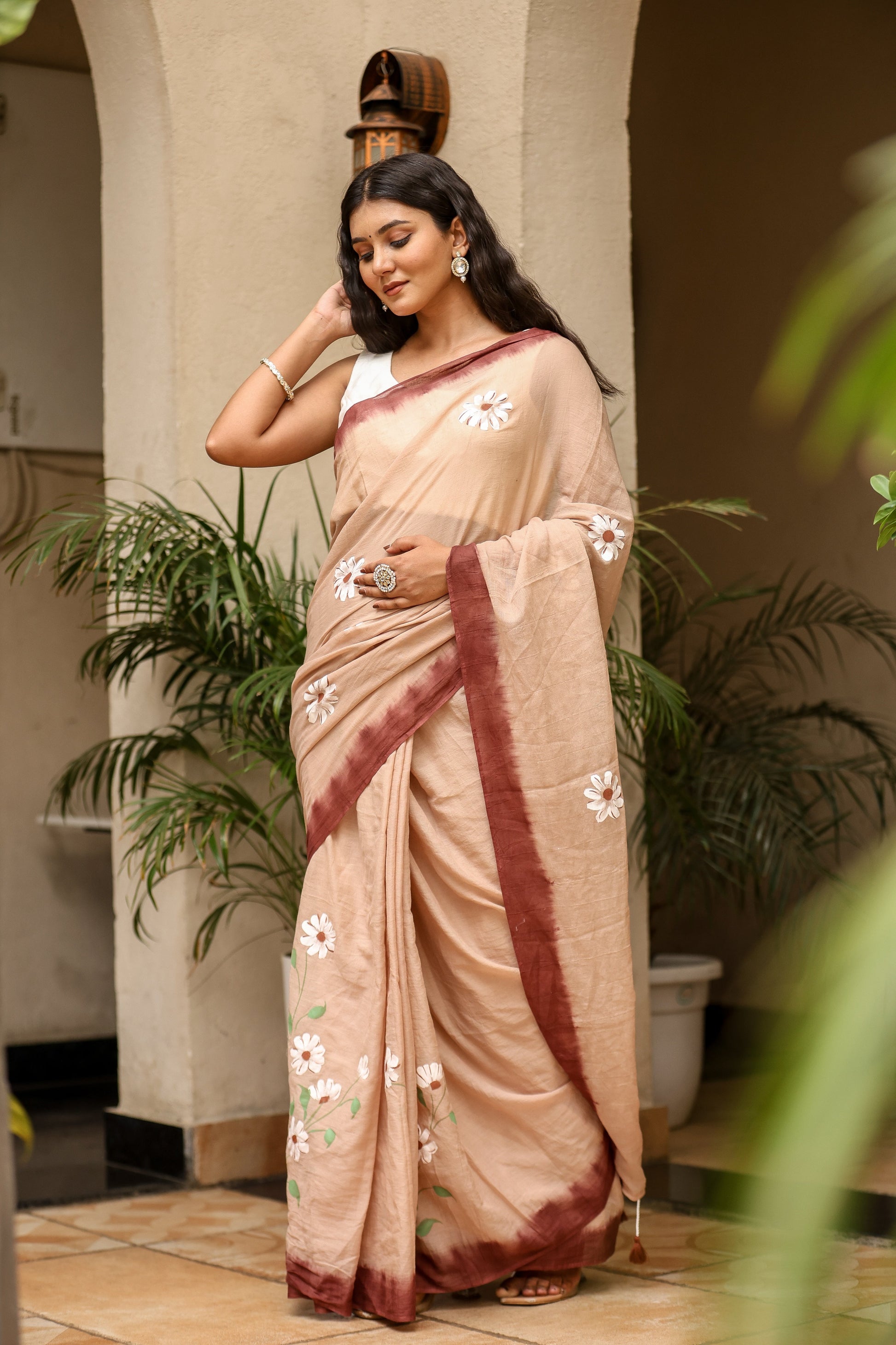 Elegant Stylera malmal saree with designer border, featuring floral embroidery and a soft beige color