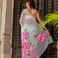 Elegant woman in a pastel chiffon saree with floral prints, perfect to buy trendy chiffon saree