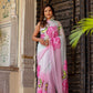 Elegant woman wearing a pink floral design chiffon saree from Stylera to buy trendy chiffon saree