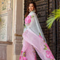 Model showcasing a buy trendy chiffon saree with pink floral patterns, perfect for festive occasions.