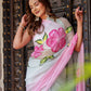 Elegant woman in a floral trendy chiffon saree posing gracefully against a decorative door, perfect to buy trendy chiffon saree.