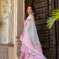 Stylish woman in a pink and grey trendy chiffon saree for elegant occasions. Buy trendy chiffon saree.