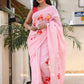 Model wearing a pink malmal saree with floral designs, perfect for casual wear. Buy trendy malmal saree.