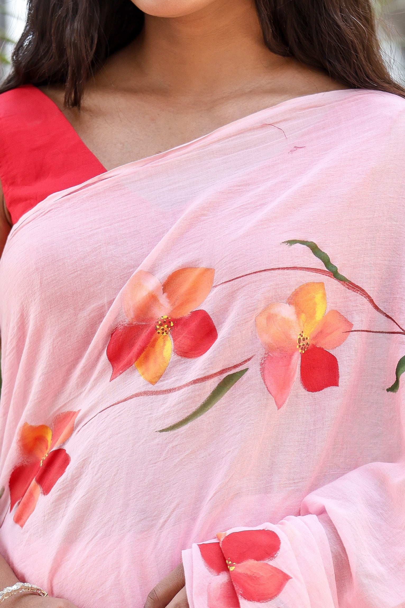 Buy trendy malmal saree in soft pink with floral patterns for elegant style and comfort