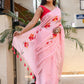 Elegant pink malmal saree with floral prints and tassels, perfect to buy trendy malmal saree.