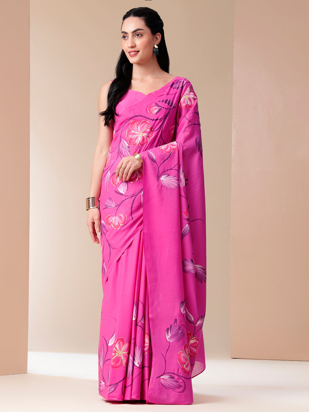 Women wearing a Calm Canvas floral saree in vibrant pink with beautiful floral patterns