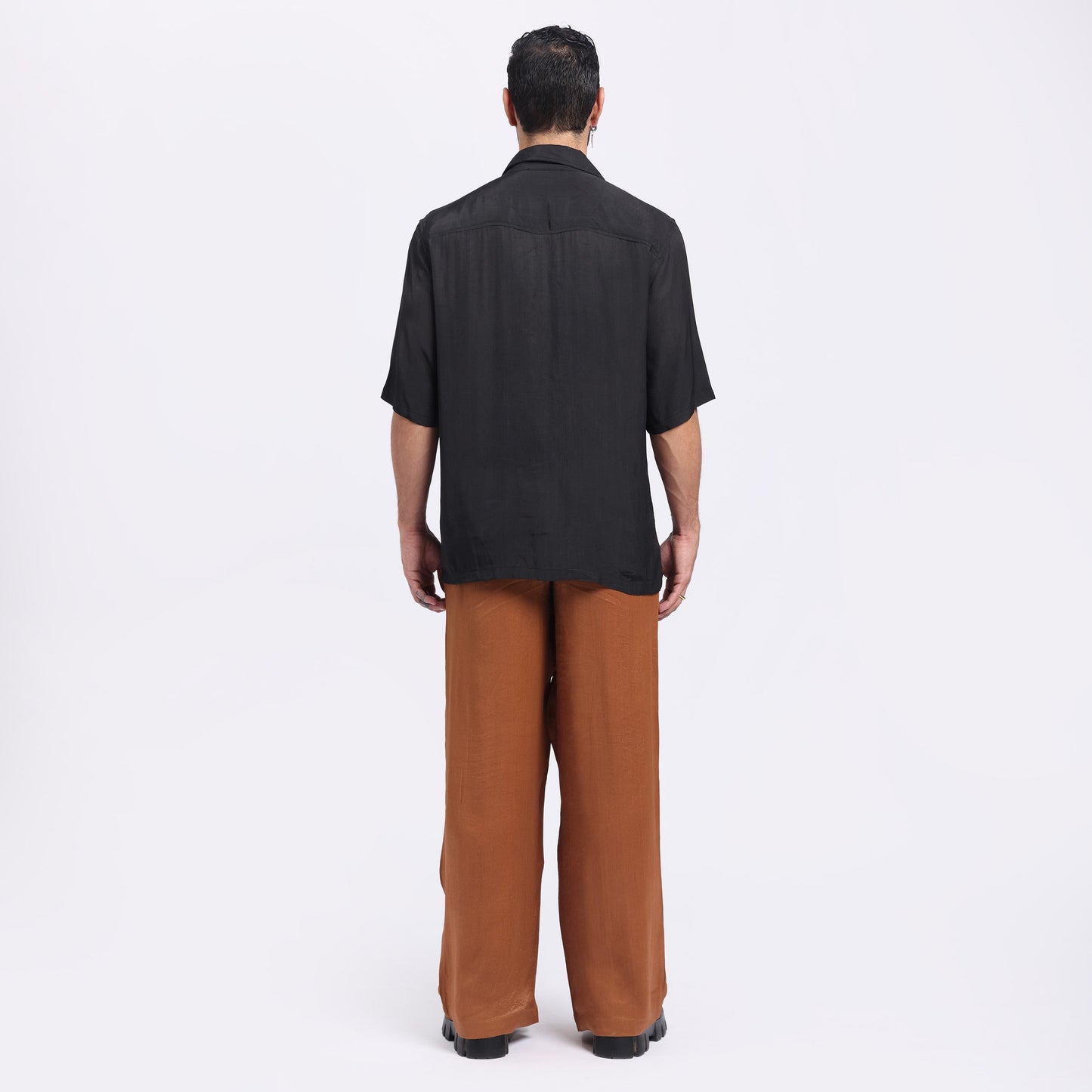 Stylera caramel wide leg pants shown from the back, featuring a relaxed fit and perfect for casual wear.