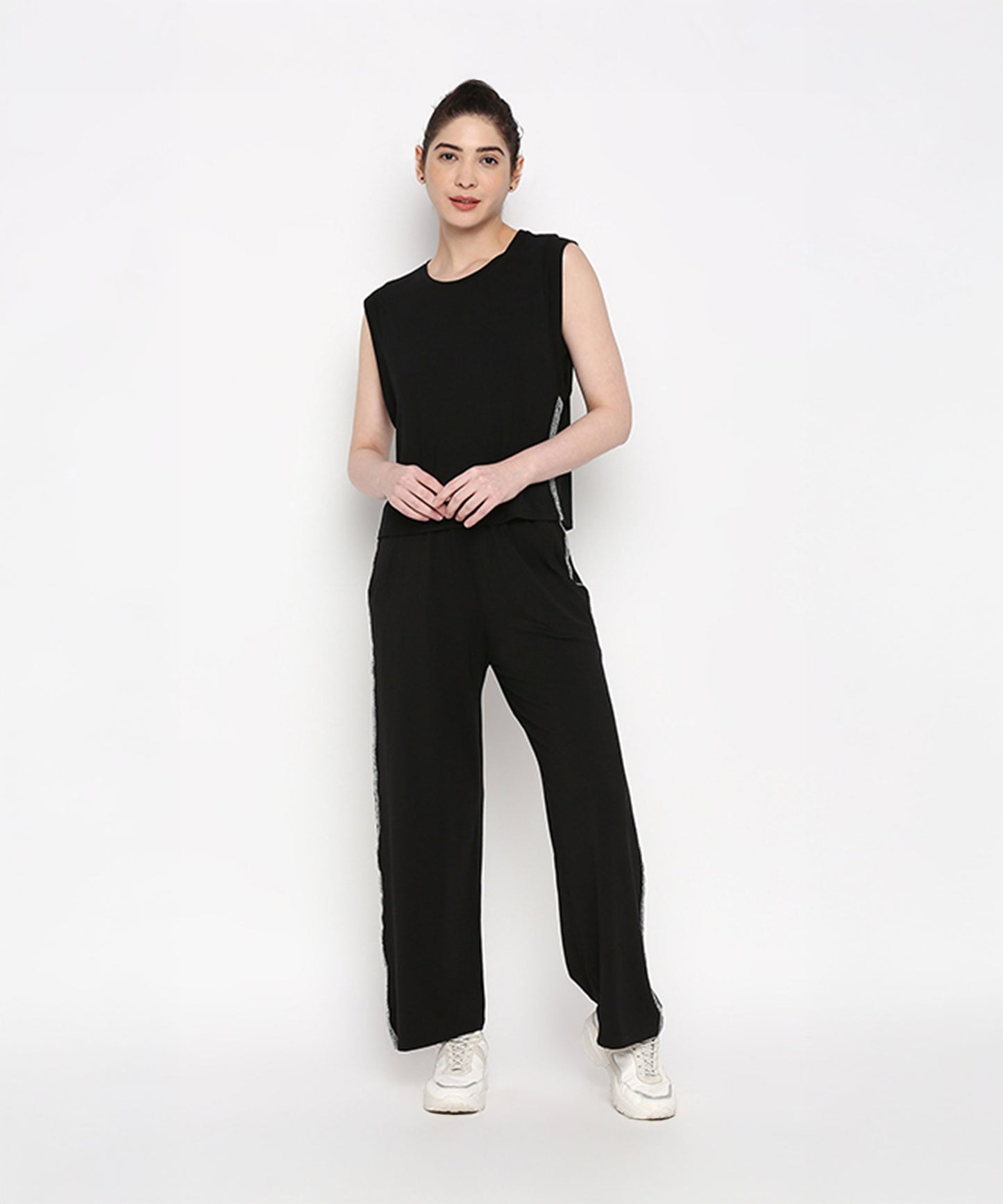 Casual black pants and top set by Stylera, featuring a sleeveless top and wide-leg trousers