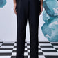 Back view of casual black wool trousers by Stylera worn with black shoes
