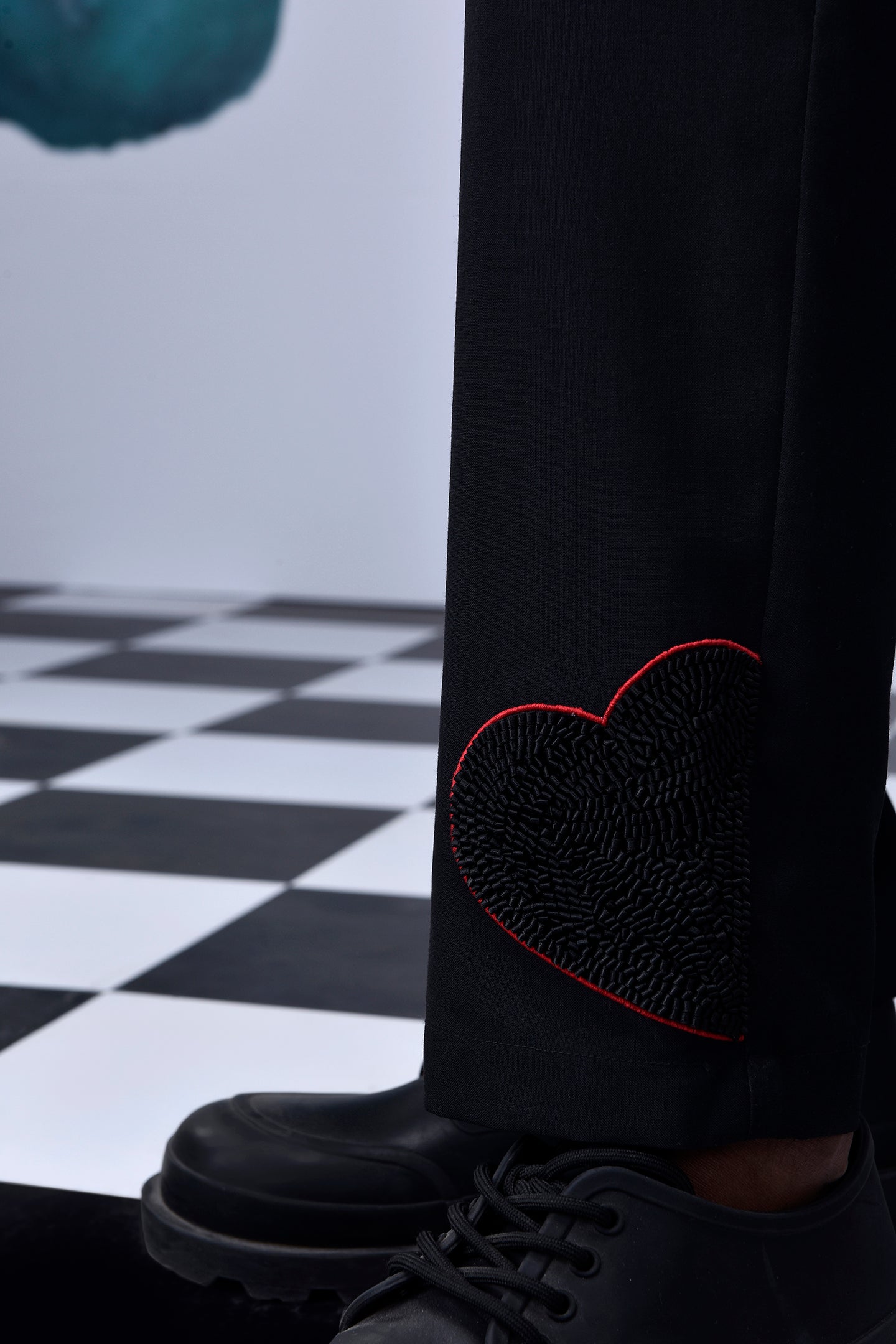 Stylera casual black wool trousers with heart embroidery detail near the ankle