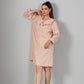 Stylish casual checkered dress for women in peach tones, perfect for everyday wear.