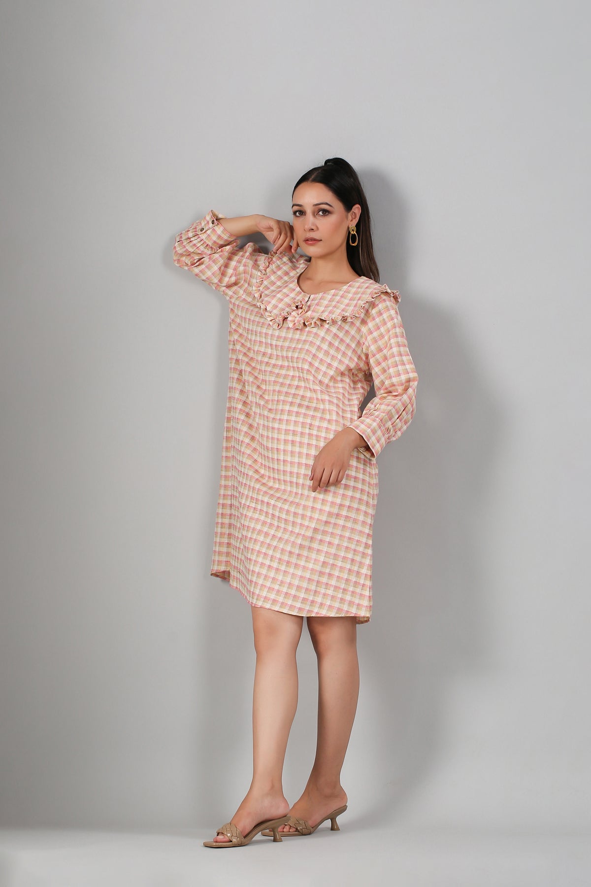 Stylish casual checkered dress for women in peach tones, perfect for everyday wear.