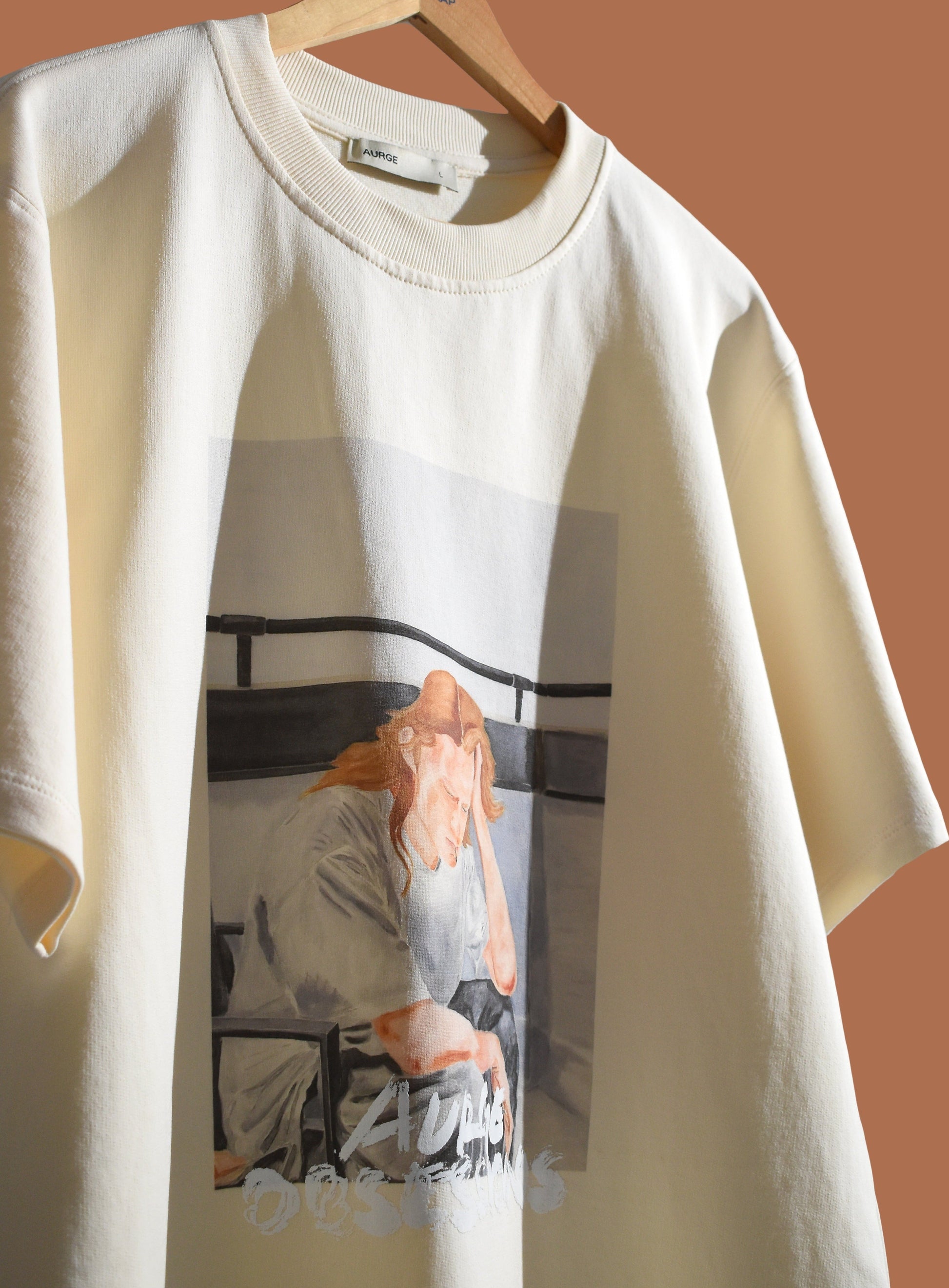 Stylera casual fashion tee shirt featuring an artistic graphic print on a cream background