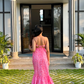 Stylera casual floral maxi dress back view on woman standing outside modern entryway