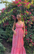 Model wearing Stylera pink paisley casual floral maxi dress with V neckline and ruffle hem in garden