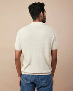 Back view of a men's casual linen polo for men in soft beige color, perfect for warm weather.