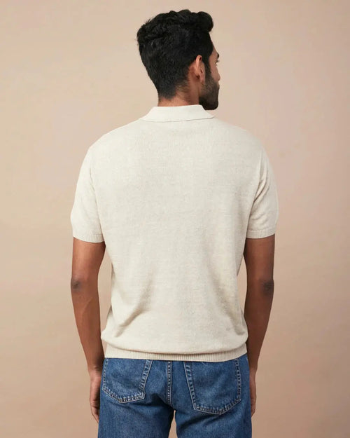 Back view of a men's casual linen polo for men in soft beige color, perfect for warm weather.