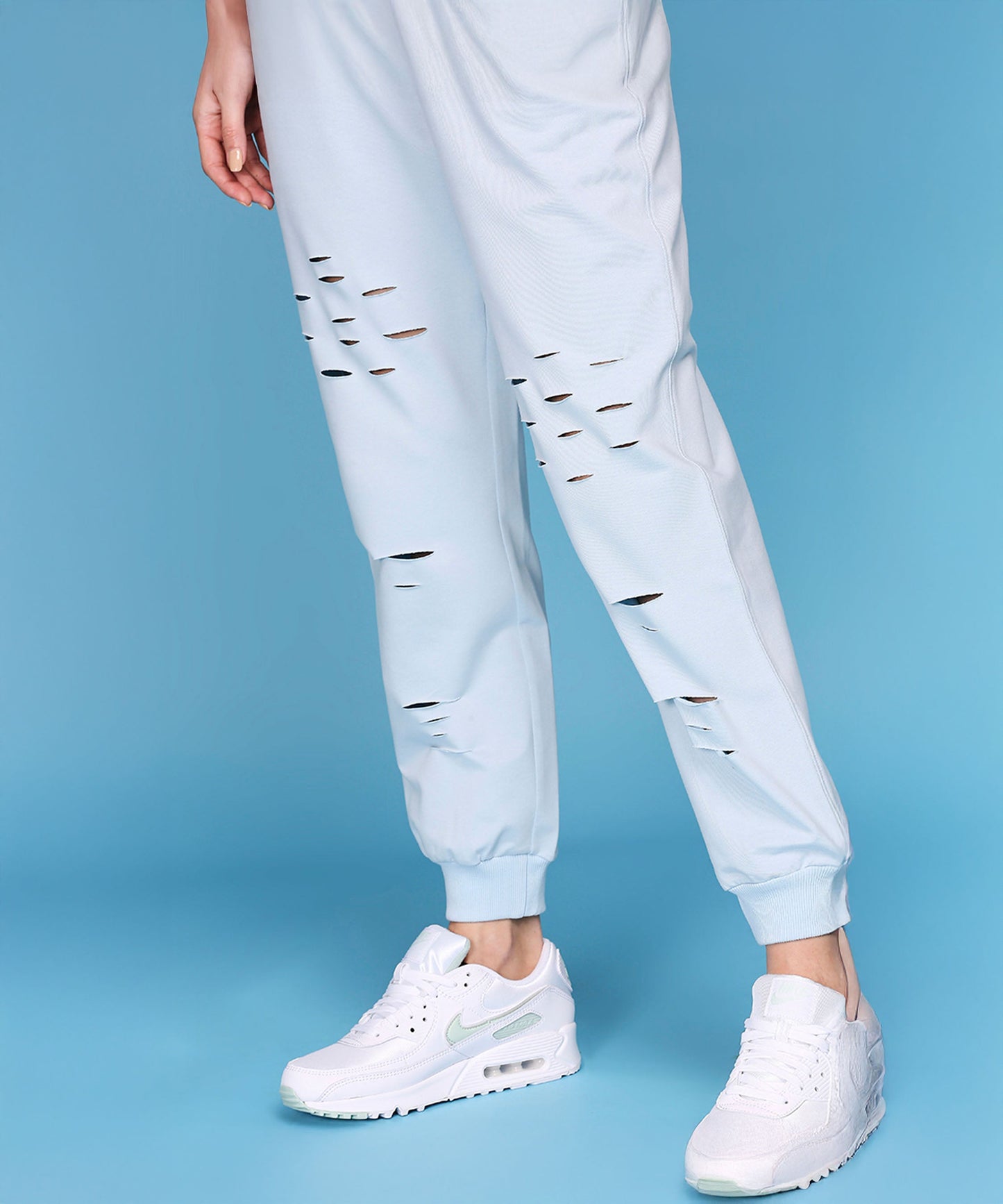 Light blue casual off shoulder lounge set with stylish distressed joggers for a relaxed look
