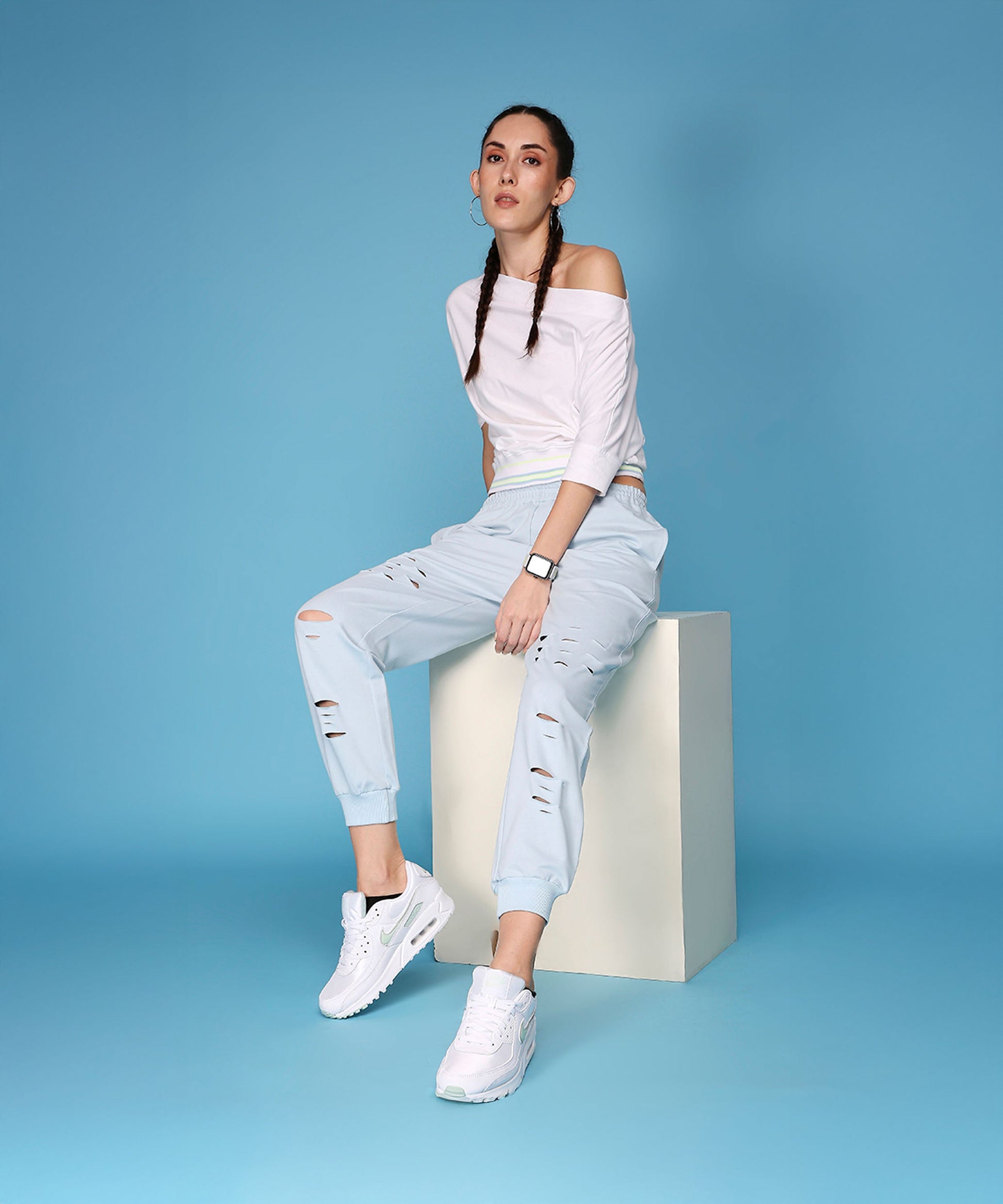 Stylera casual off shoulder lounge set in light blue featuring distressed joggers and a fitted top