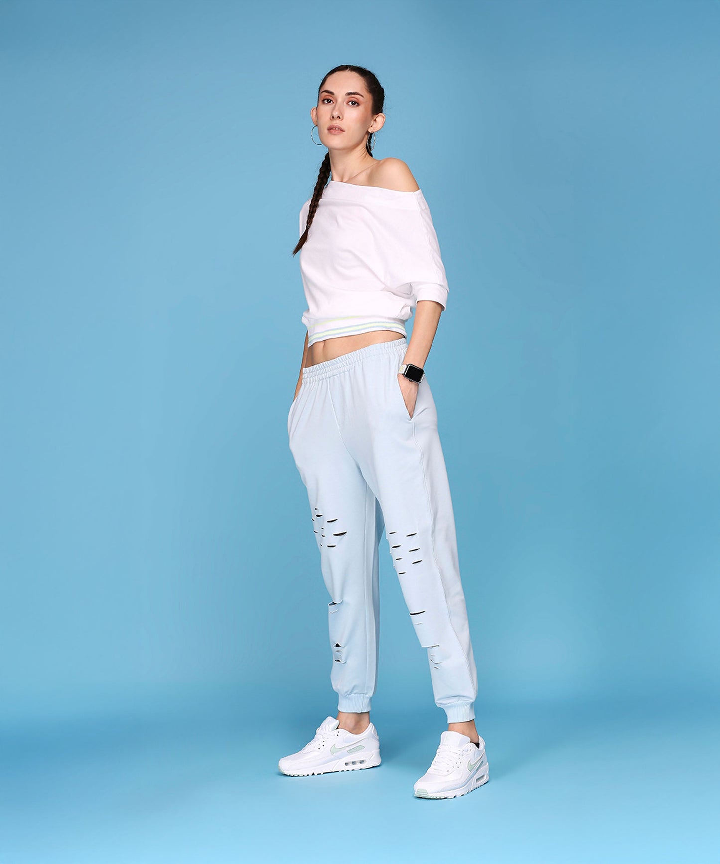 Casual off shoulder lounge set from Stylera featuring a relaxed top and stylish joggers with distressed details