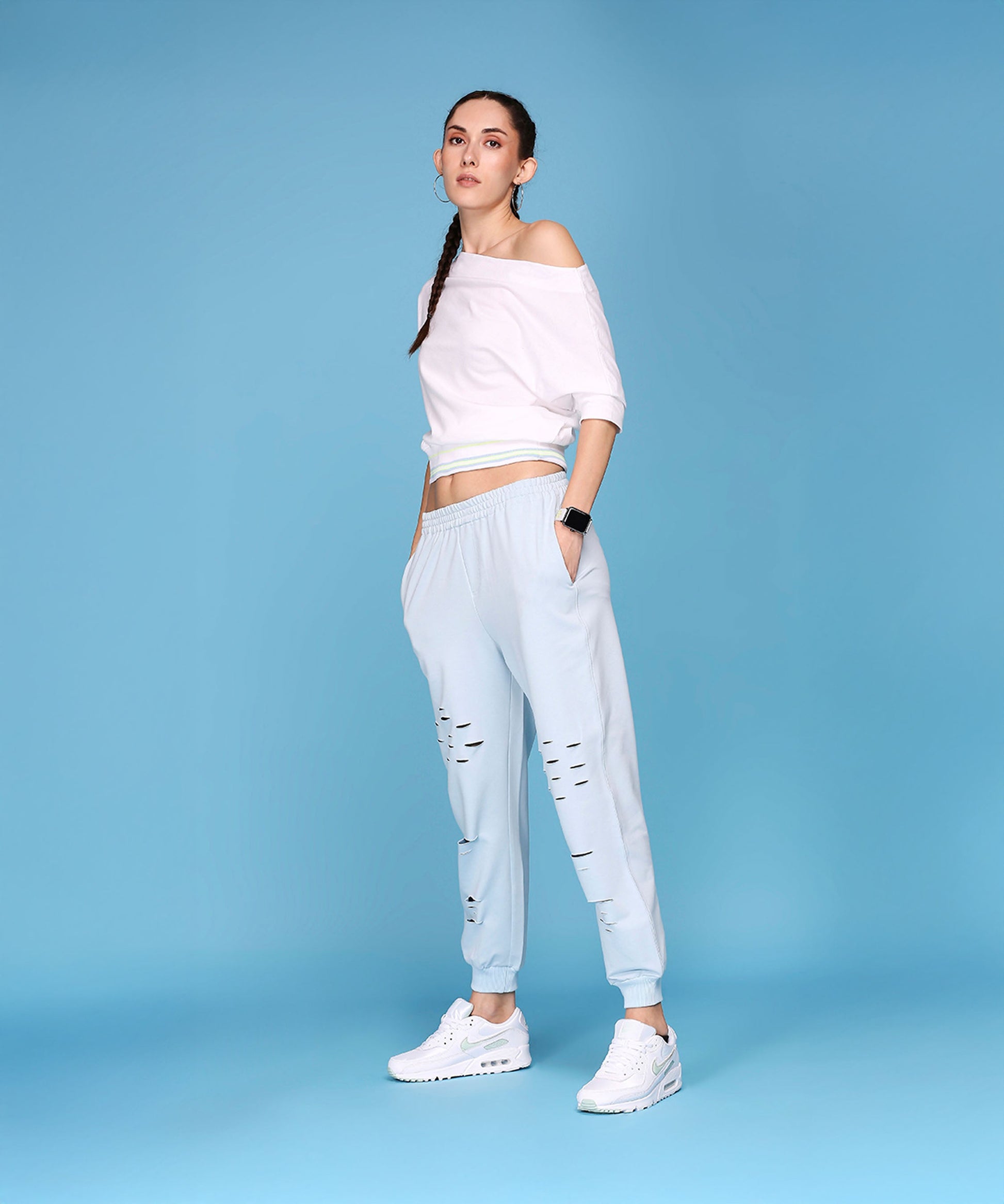 Casual off shoulder lounge set from Stylera featuring a relaxed top and stylish joggers with distressed details