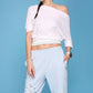 Casual off shoulder lounge set featuring a white top and light blue pants with stylish cutouts