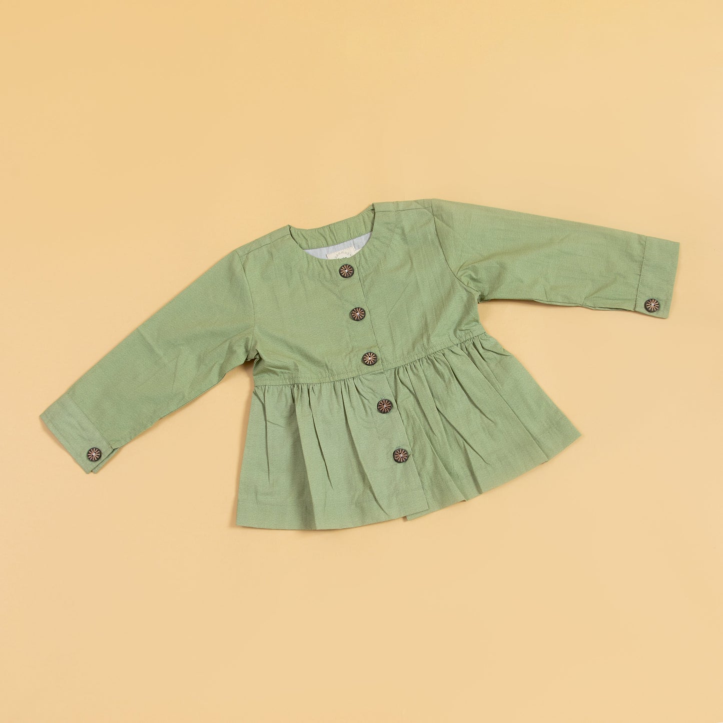 Casual olive green top with button front and gathered waist for a relaxed fit