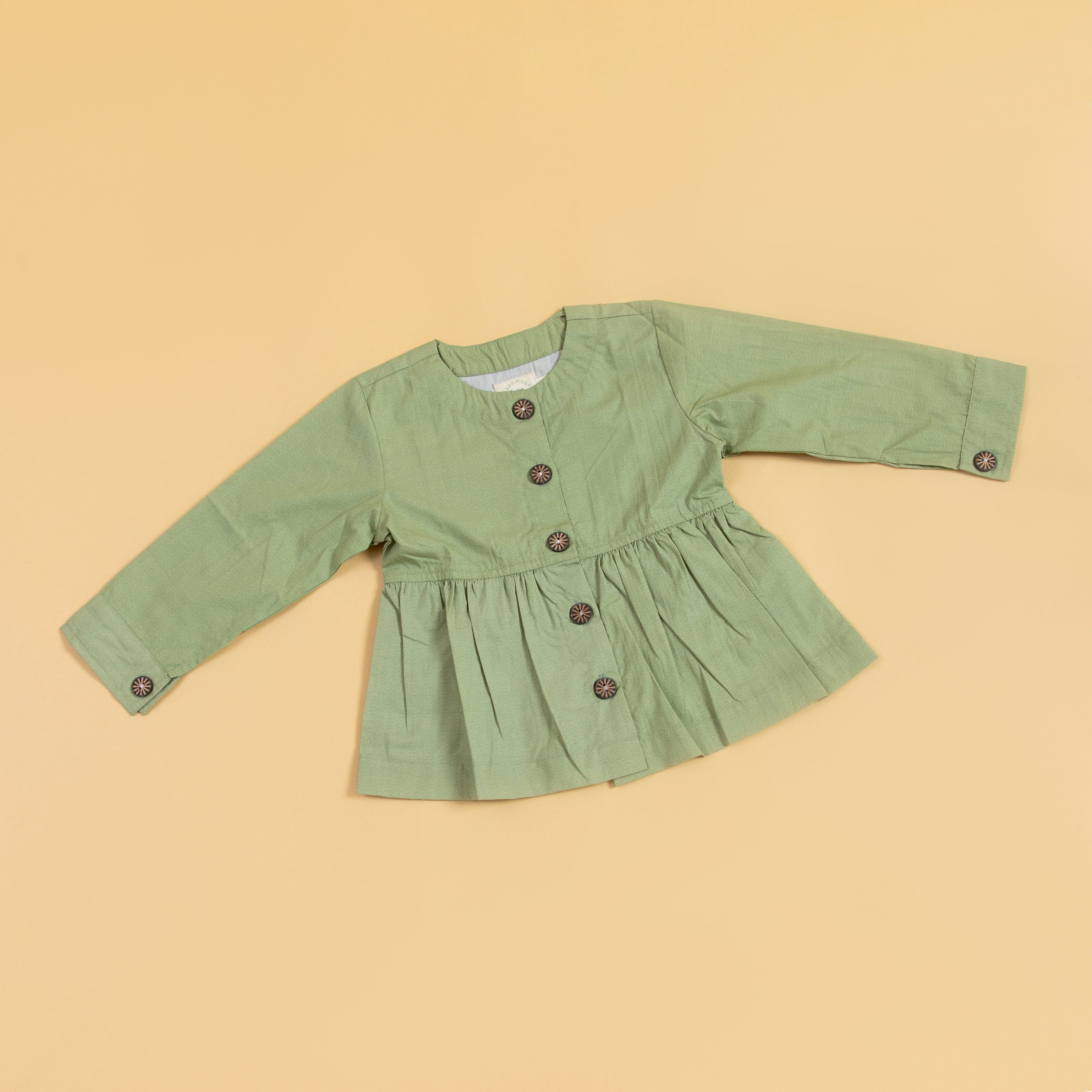 Casual olive green top with button front and gathered waist for a relaxed fit