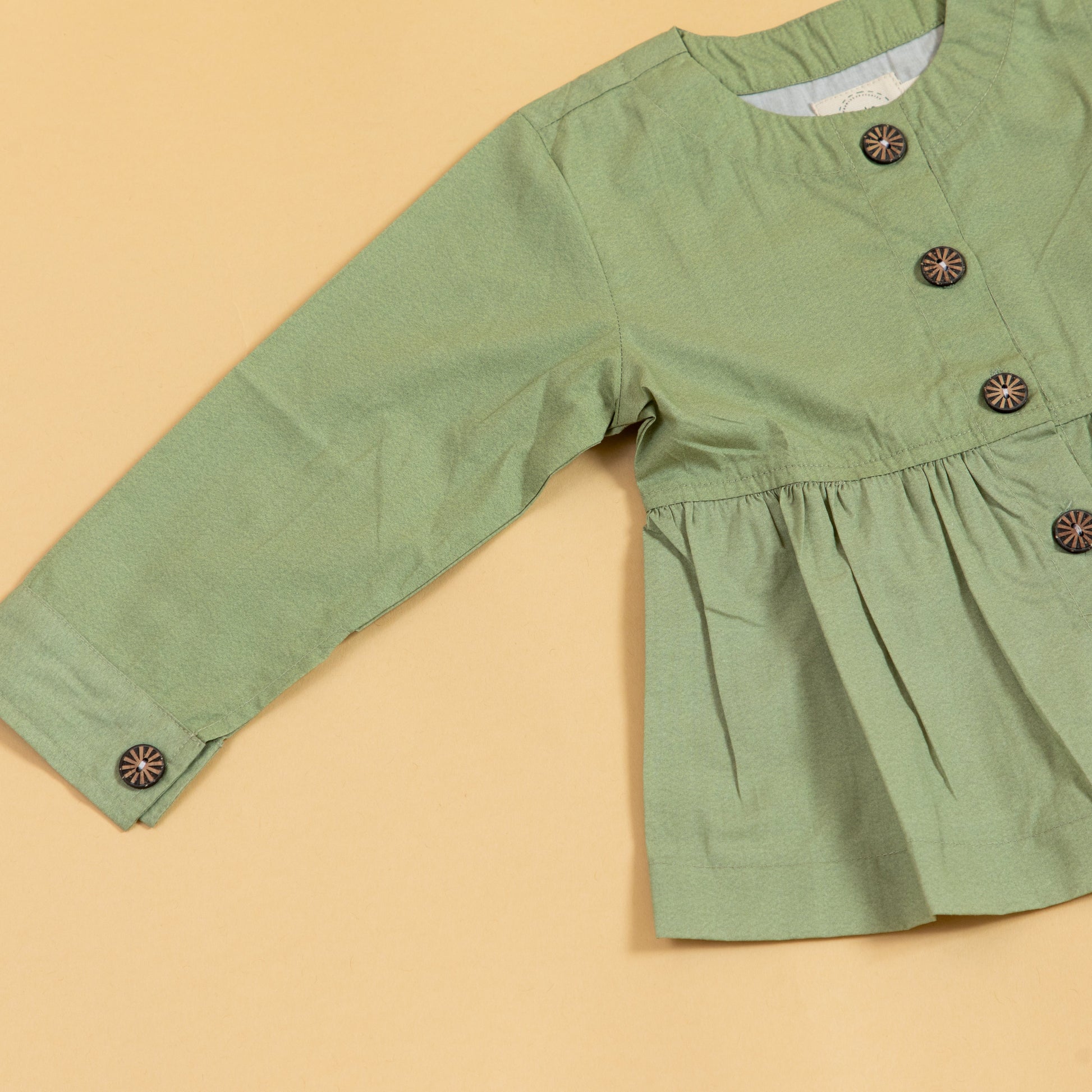 Stylera casual olive green top with a button-down design and relaxed fit