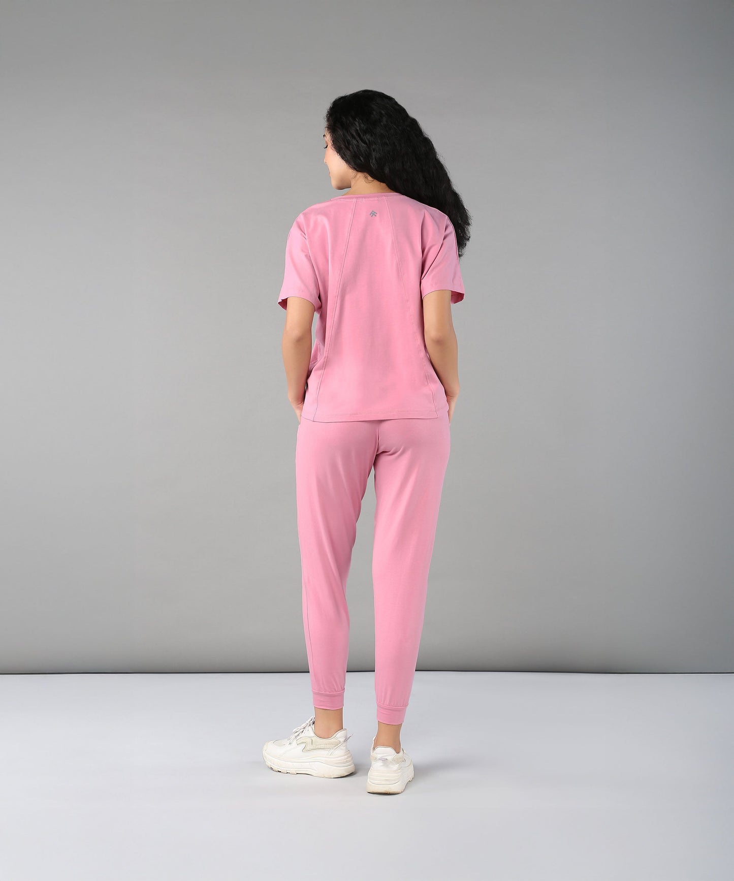 Back view of women in casual pink lounge wear for women featuring comfortable fit and soft fabric