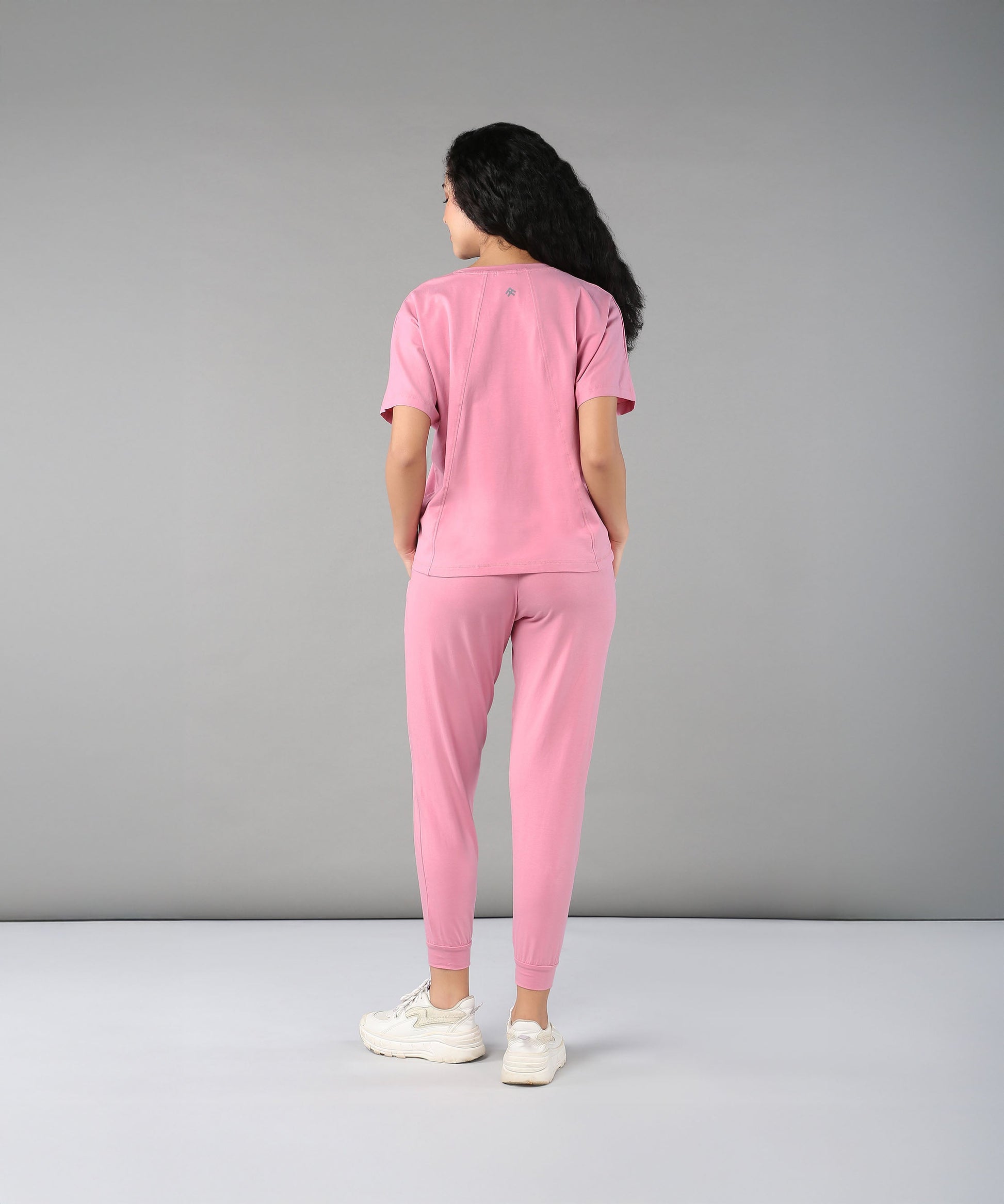 Back view of women in casual pink lounge wear for women featuring comfortable fit and soft fabric