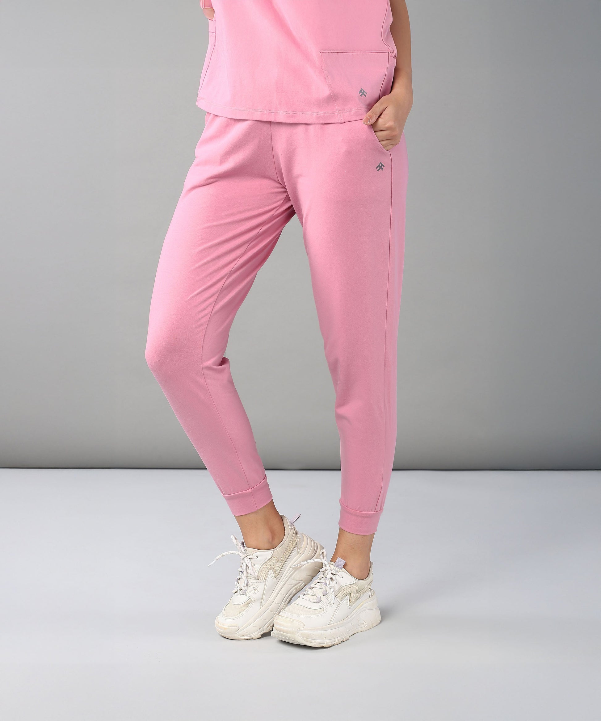 Comfortable casual pink lounge wear for women featuring a stylish top and fitted pants