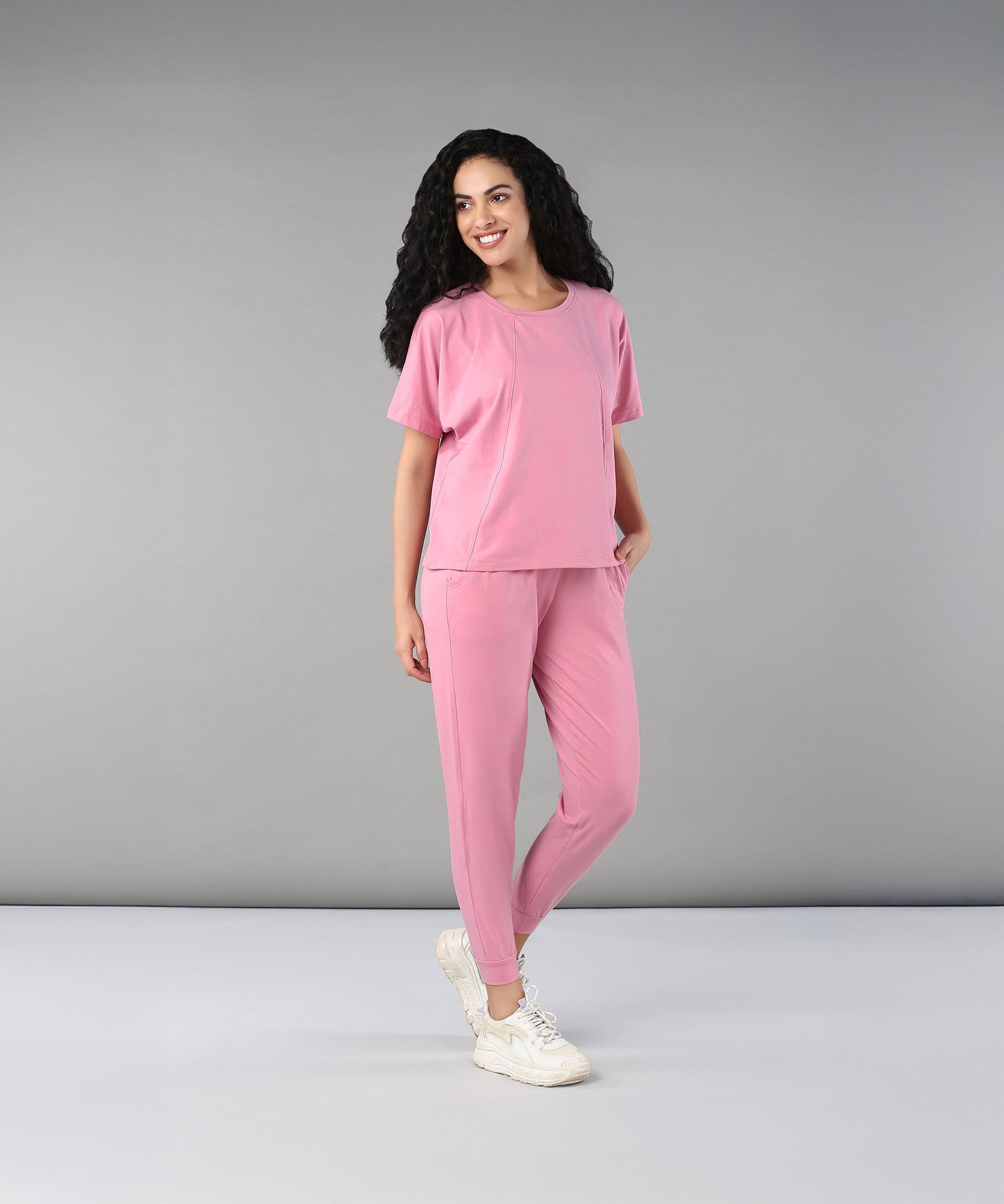 Woman modeling casual pink lounge wear for women with a comfortable fit and modern style