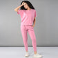 Trendy casual pink lounge wear for women featuring a relaxed fit top and tapered pants