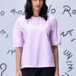 Stylera casual pink top for women on model with gathered neckline elbow sleeves relaxed fit black pants