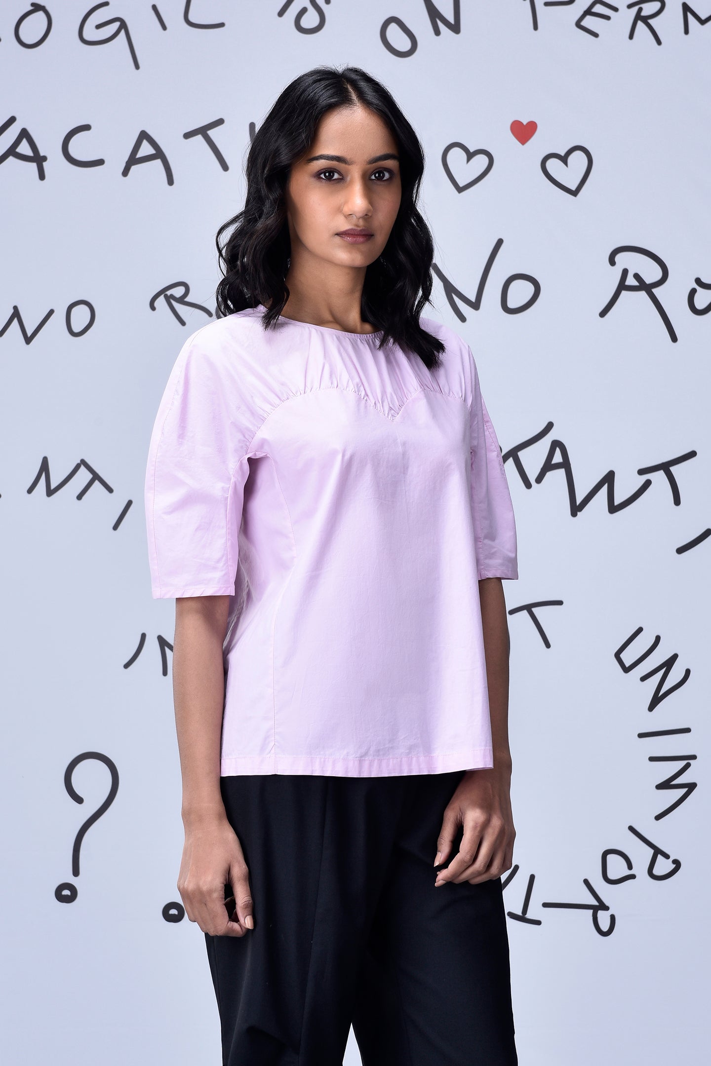 Stylera casual pink top for women with elbow sleeves relaxed fit paired with black trousers
